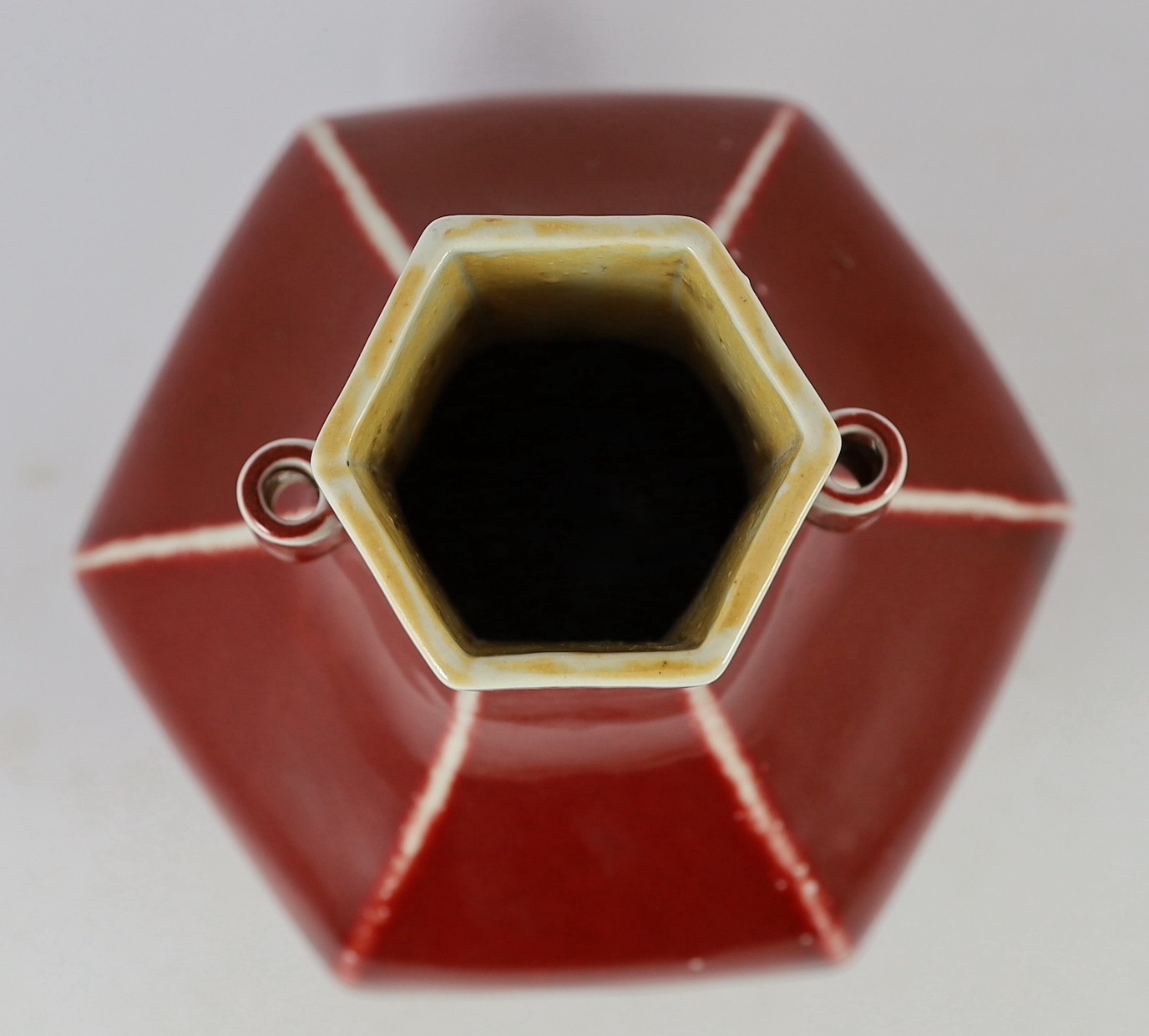 A Chinese copper red glazed hexagonal hu vase, late 19th/early 20th century, 28cm high